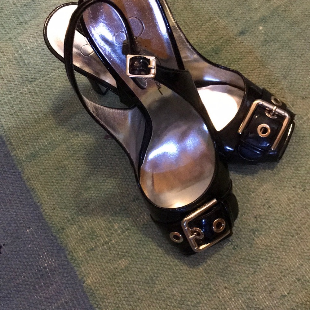 Open toe black patten leather pump.